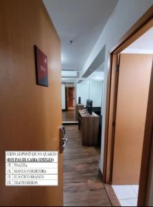 an open door to an office with a sign on it at 511. Flat Hotel S4 in Brasilia