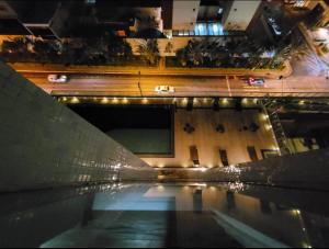a pool of water in front of a building at 511. Flat Hotel S4 in Brasilia