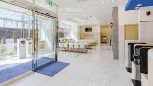 a room with a conference room with a table and chairs at Toyoko Inn Osaka Dome Mae in Osaka