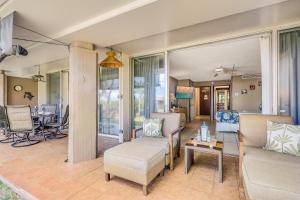 a living room with a couch and chairs and a table at Eldorado D106 in Kahana