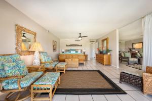 a living room with a couch and chairs at Eldorado A203 in Kahana