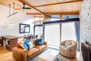 a living room with a couch and a table at Chalet Setsugekka in Hakuba