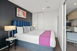 Ein Bett oder Betten in einem Zimmer der Unterkunft Proximity Apartments Manukau / Auckland Airport