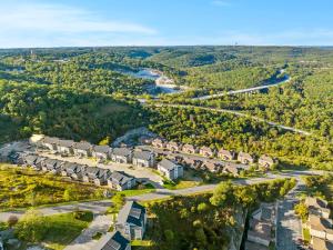 an aerial view of a subdivision of houses and a river at Vineyards Escape 3 in Branson