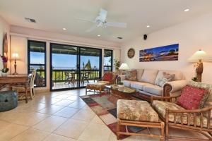 a living room with a couch and a table at Kaanapali Plantation 8 in Lahaina