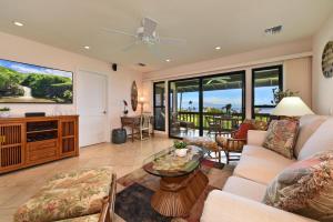 a living room with a couch and a table at Kaanapali Plantation 8 in Lahaina