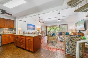 a kitchen and living room with a large open floor plan at Koa Resort 3J in Kihei
