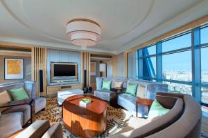 a living room with a couch and a table at The Westin Xiamen in Xiamen