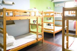 a group of bunk beds in a room at Changsha Fuxiangyuan International Hostel in Changsha