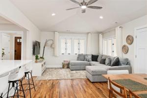 a living room with a couch and a table at Luxury mountain oasis, hot tub & 15 mins to DT AVL in Juno