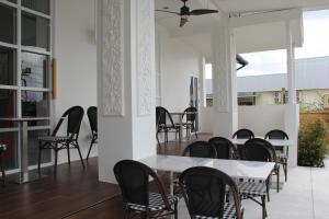a dining room with a table and chairs at Luckswan Boutique Chiang Rai - SHA Extra Plus in Chiang Rai