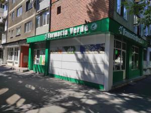 a store on the side of a street at Apartament 2 camere tip studio in Râmnicu Vâlcea