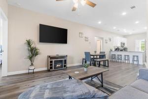 a living room with a fireplace and a tv on the wall at Vineyards Escape 4 in Branson