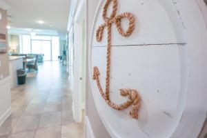 a rope hanging on a wall in a hallway at Phoenix Orange Beach II 1104 in Orange Beach