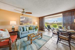 a living room with a couch and a table at Eldorado K104 in Kahana