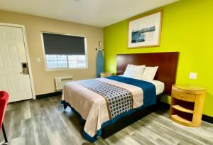 מיטה או מיטות בחדר ב-4 Star Motel