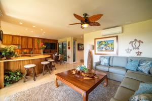 a living room with a couch and a table at Wailea Ekahi 32B in Wailea