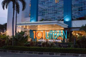 a hotel with a sign on the front of it at 1O1 URBAN Jakarta Kelapa Gading in Jakarta