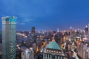 a view of a city skyline at night at The St. Regis Shanghai Jingan in Shanghai
