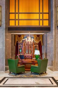 a living room with two chairs and a couch at The St. Regis Shanghai Jingan in Shanghai