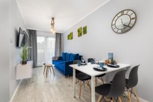 Posedenie v ubytovaní Kapitański Mostek Apartments Kołobrzeg by Noclegi Renters
