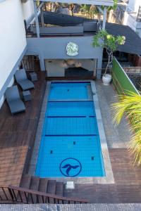 an overhead view of a swimming pool on a building at Rabasta Enjoy Kuta in Denpasar