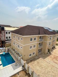 an aerial view of a building with a swimming pool at 1118 Serenity Residence in Abuja