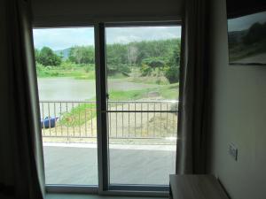 Balkón nebo terasa v ubytování Sunrise Island Homestay