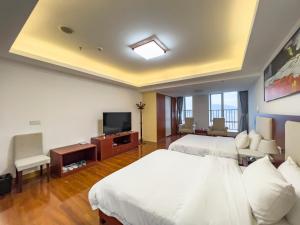 Televisyen dan/atau pusat hiburan di Guangzhou Zhicheng Leader Tour International Apartment-The Legend Building-FREE SHUTTLE BUS FOR CANTON FAIR-1mins to Line5 STN