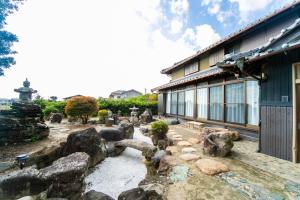 Κήπος έξω από το Nagashima Traditional House in Tonome