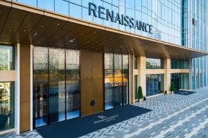 a building with a sign on the side of it at Renaissance Nanning Hotel in Nanning