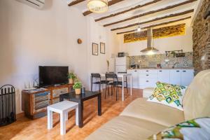 a living room with a couch and a table at Paraje la Suerte Apartamento Dalia in Adra