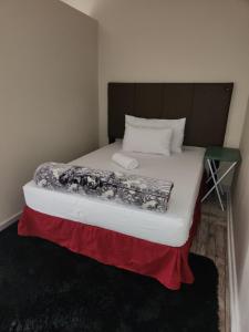 a bed in a small room with at HUNTERS NEST GUEST HOUSE MAFIKENG in Mahikeng