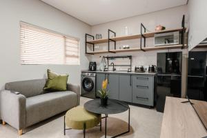 a living room with a couch and a table at 80 on Thabo in Potchefstroom