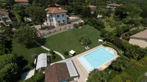 an aerial view of a house with a swimming pool at Villa Angela Luxury Relax in Desenzano del Garda