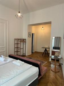 a living room with two beds and a mirror at Centrally-Located authentic apartment in Vienna