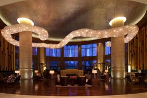 a large lobby with a large chandelier in the ceiling at The Westin Changbaishan Resort in Fusong