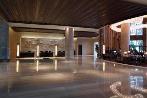 a lobby of a hotel with a large room at The Westin Changbaishan Resort in Fusong