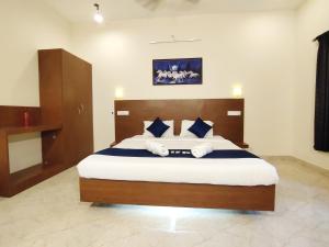 En eller flere senge i et værelse på PV Resort - Auro Beach