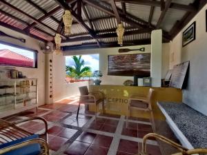 a living room with a yellow table and chairs at RC Villas and Resorts in El Nido