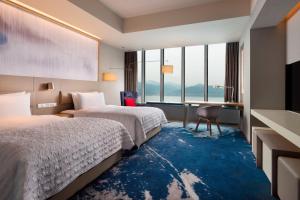 Postel nebo postele na pokoji v ubytování Le Meridien Hangzhou, Binjiang