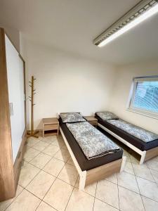 Postel nebo postele na pokoji v ubytování Ubytování Pardubice Trnová