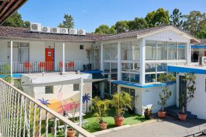 an image of a house with a balcony at Baileys Parkside Motel by VetroBlu in Perth