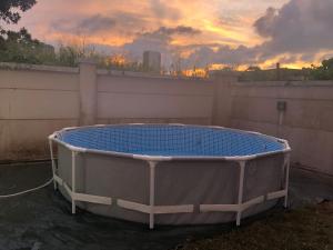 a hot tub sitting on the side of a fence at Luxurious Villa with BBQ & JACUZZI By The Beach Batu Ferringhi in Batu Ferringhi