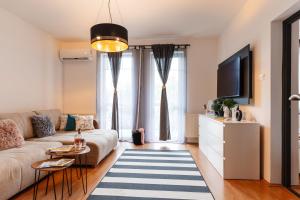 Televízia a/alebo spoločenská miestnosť v ubytovaní BB21 Apartman Eger - City centre