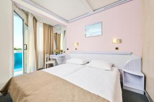 Ein Bett oder Betten in einem Zimmer der Unterkunft Hotel Plavi Plava Laguna
