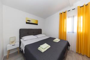 Posteľ alebo postele v izbe v ubytovaní Family apartments Zadar - Ryanair's September