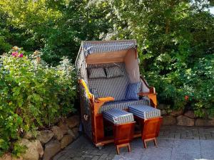 a group of chairs sitting on a patio at AHOl Ferienhaus in Redewisch