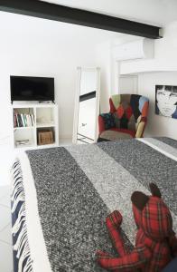 A bed or beds in a room at ComeCasa Grazioso Loft in Crocetta near Mangiagalli