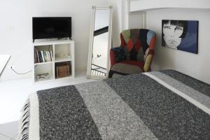 A bed or beds in a room at ComeCasa Grazioso Loft in Crocetta near Mangiagalli